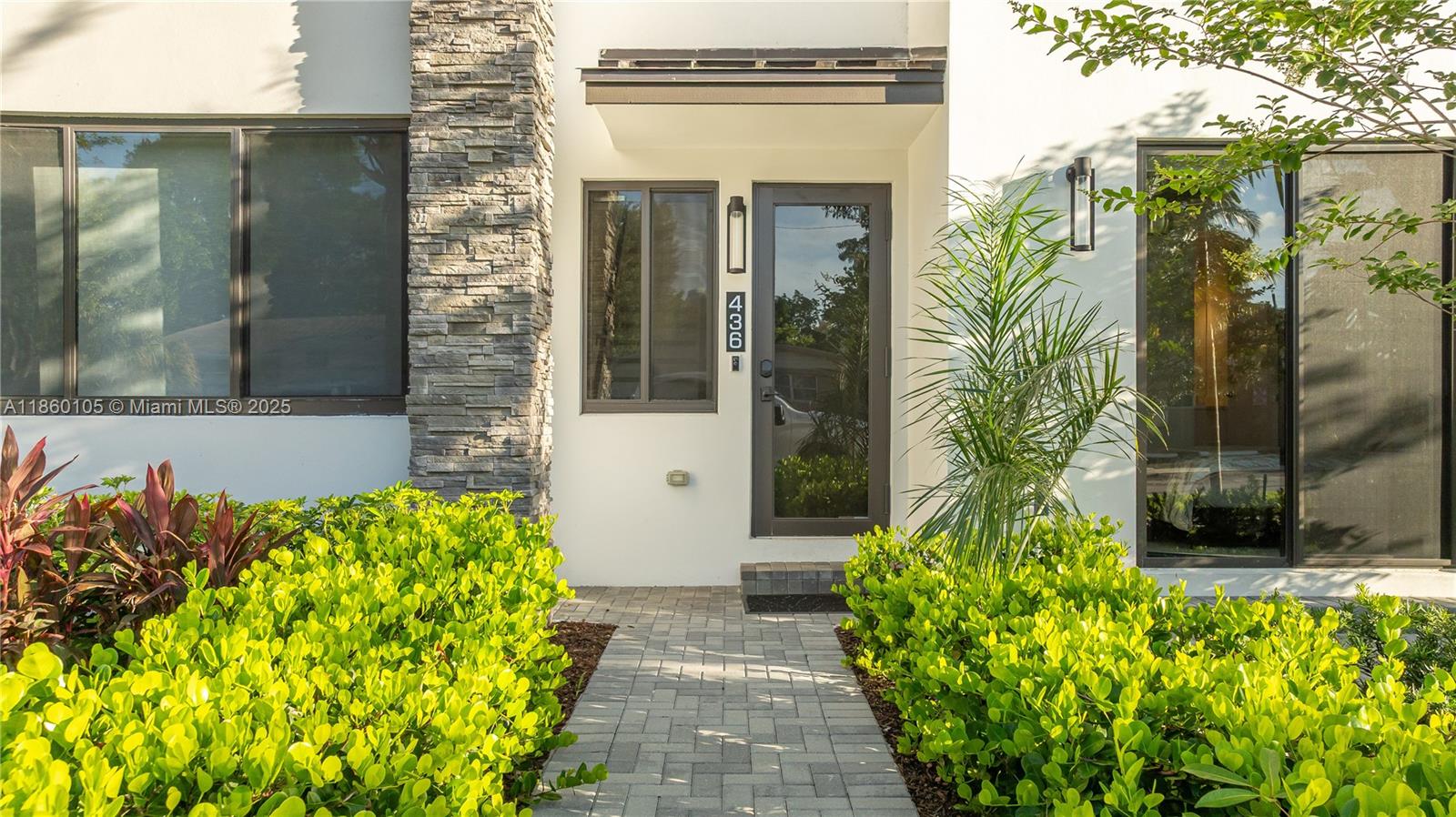 436 Southeast 12th Court Fort Lauderdale, FL 33316 - Photo 28 of 34 a front view of a house with a glass door