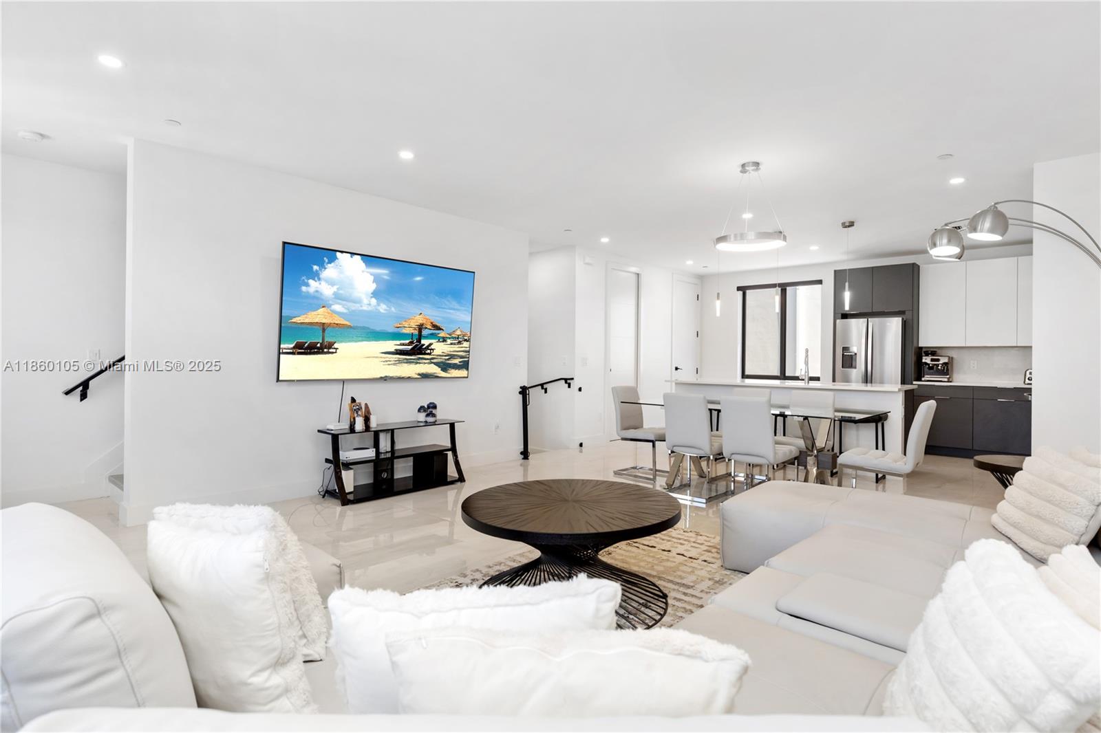 436 Southeast 12th Court Fort Lauderdale, FL 33316 - Photo 3 of 34 a living room with furniture a rug and white walls