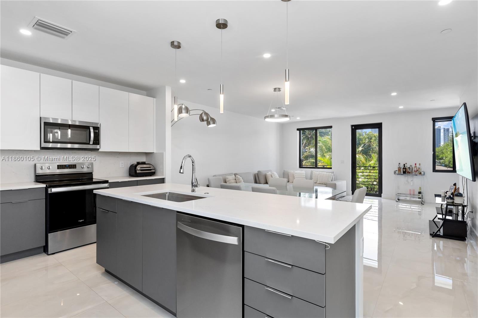 436 Southeast 12th Court Fort Lauderdale, FL 33316 - Photo 4 of 34 a kitchen with a sink stove and microwave