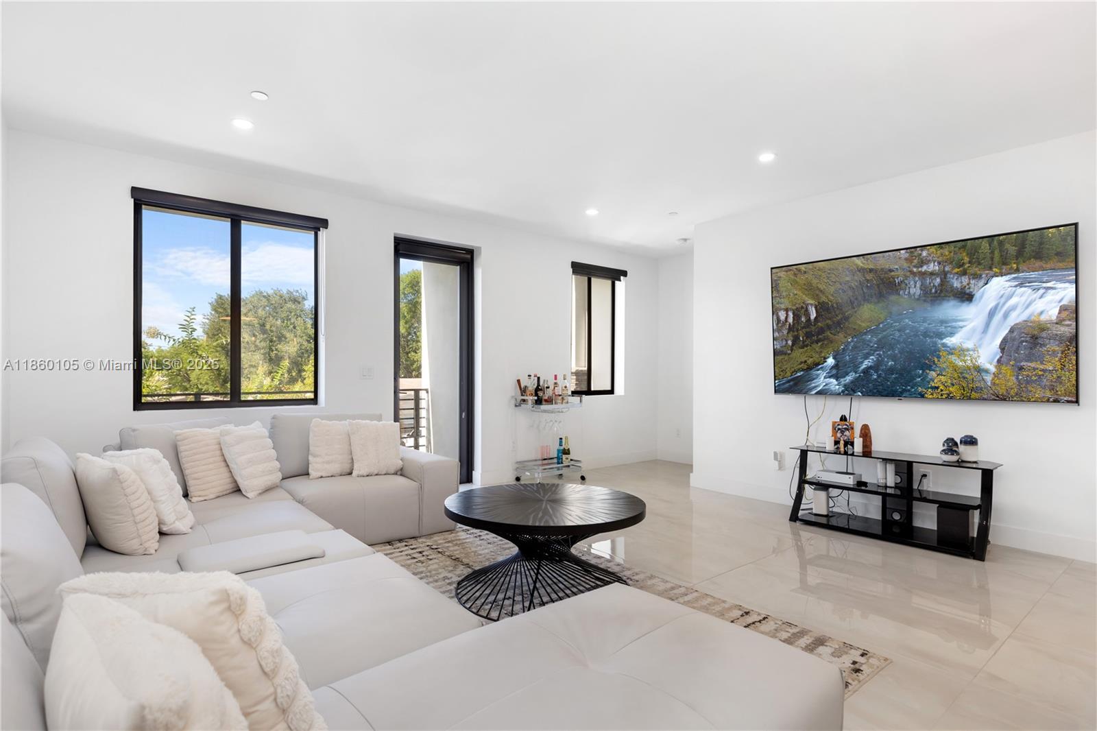 436 Southeast 12th Court Fort Lauderdale, FL 33316 - Photo 6 of 34 a living room with furniture and a flat screen tv