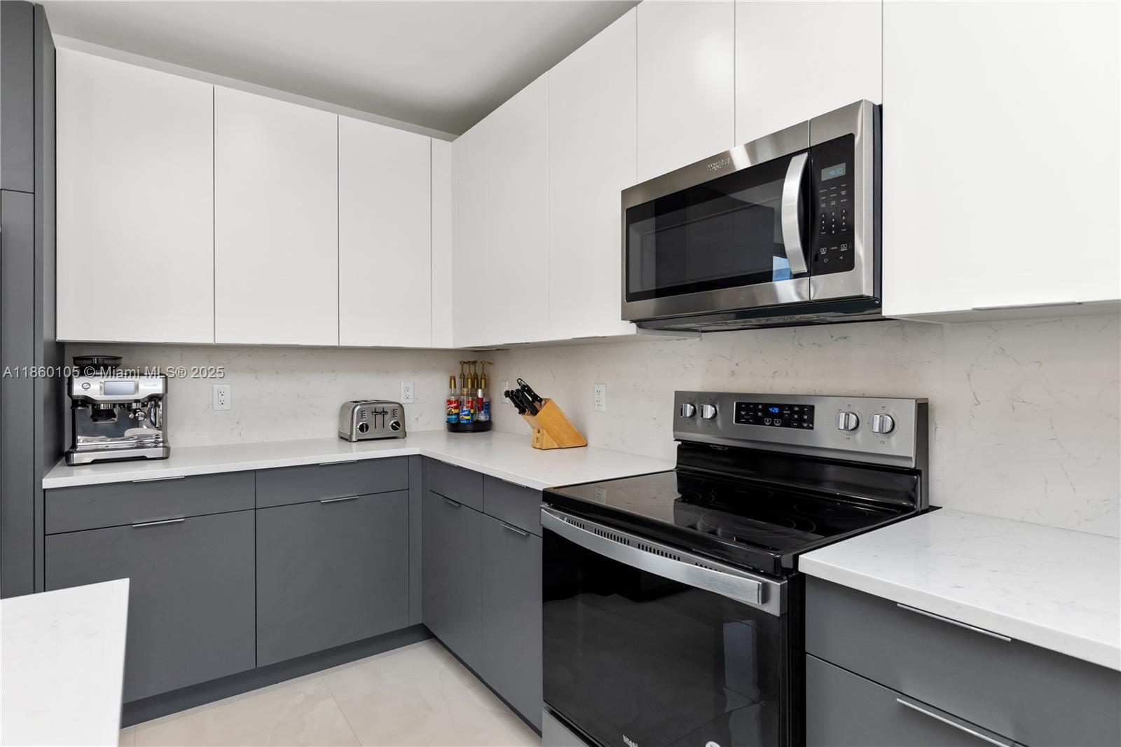 436 Southeast 12th Court Fort Lauderdale, FL 33316 - Photo 7 of 34 a kitchen with a stove and a microwave