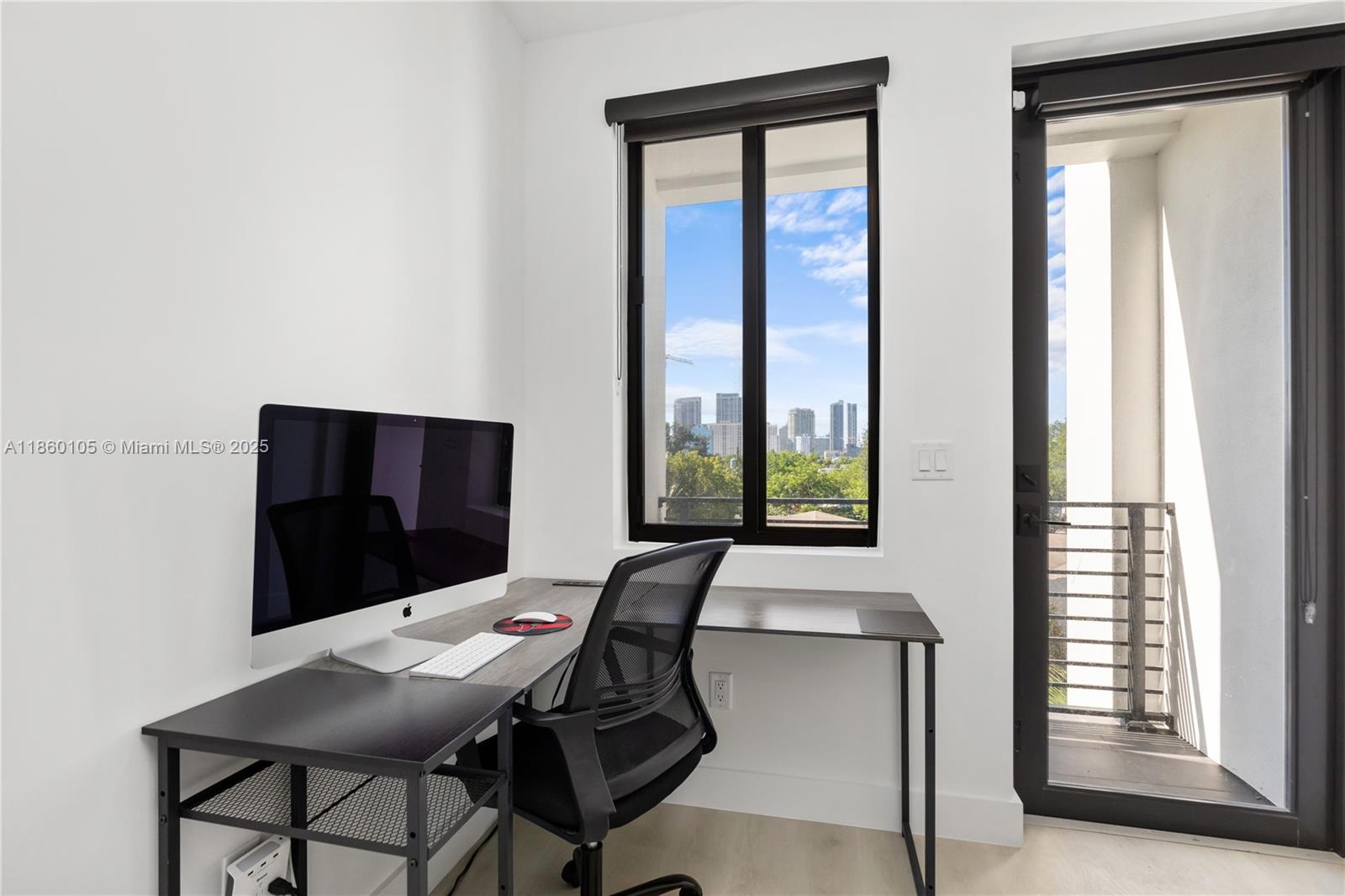 436 Southeast 12th Court Fort Lauderdale, FL 33316 - Photo 9 of 34 a workspace with furniture and window