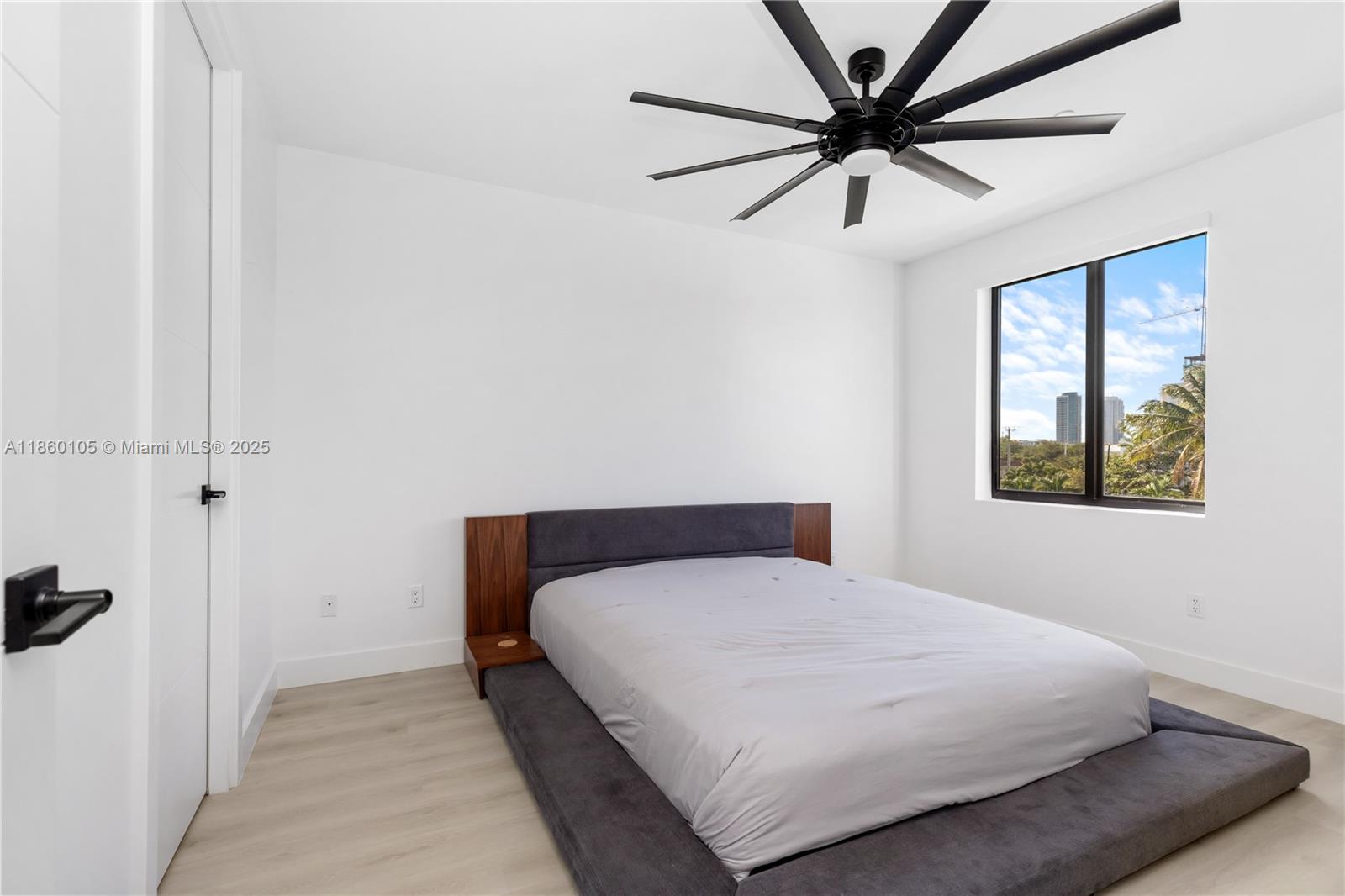 436 Southeast 12th Court Fort Lauderdale, FL 33316 - Photo 10 of 34 a bedroom with a bed and a window