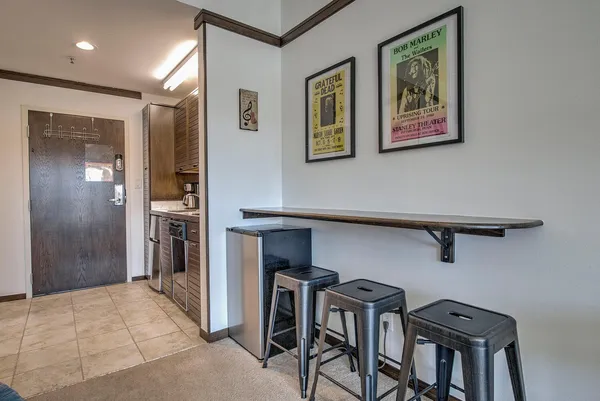 a view of a hallway with seating area