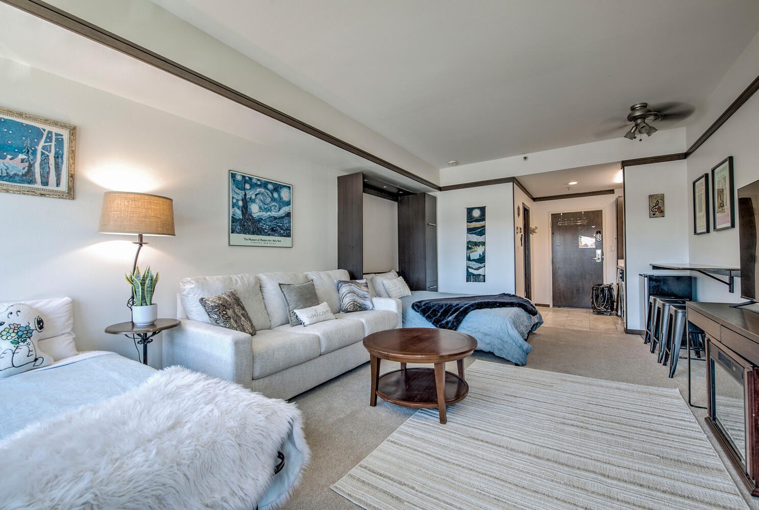 1211 West Keystone Road, Unit 2738 Keystone, CO 80435 - Photo 2 of 31 a living room with furniture and a wooden floor