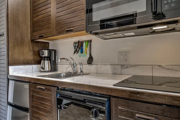 a kitchen with a stove and a microwave