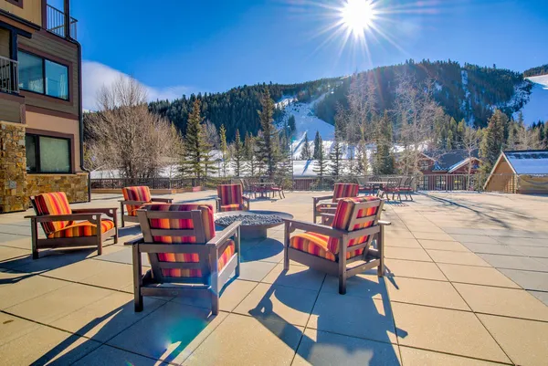 a outdoor space with patio and a fireplace