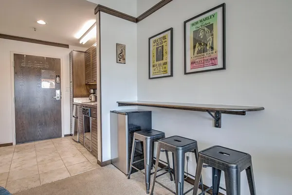 a view of a hallway with seating area