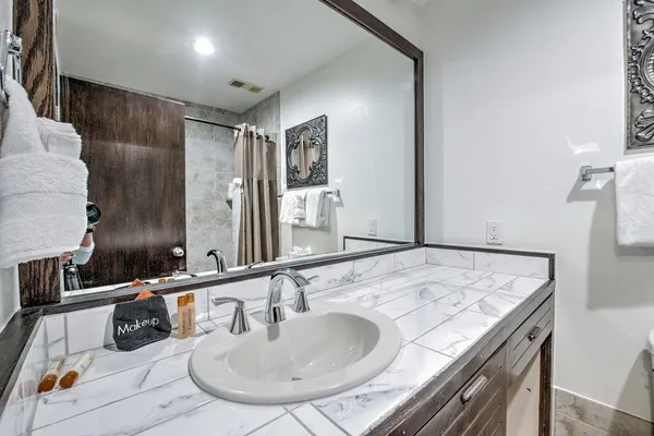 a bathroom with a sink and a mirror
