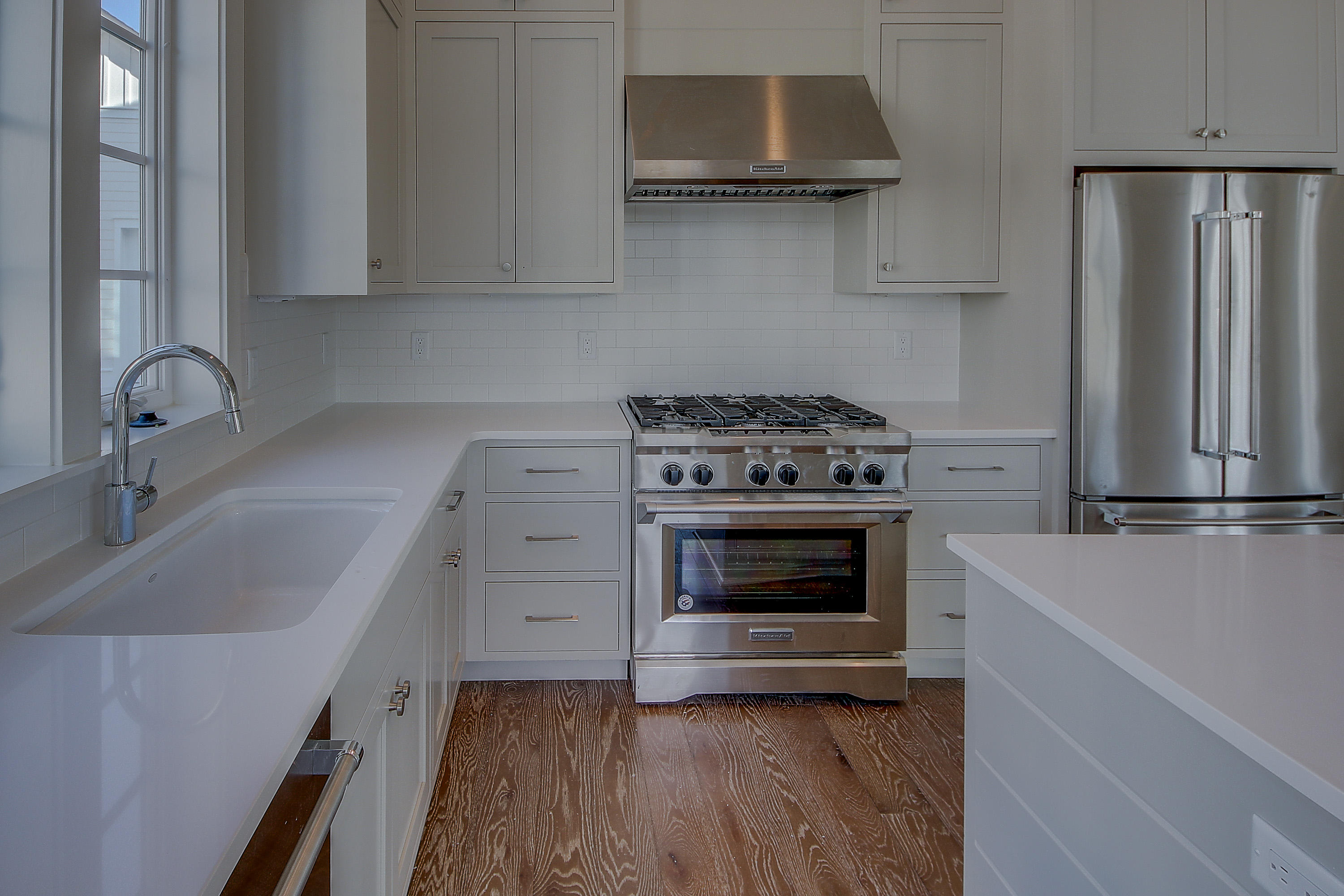 355 Pathways Drive, Unit LOT 90 Watersound, FL 32461 - Photo 5 of 24 a kitchen with stainless steel appliances a stove sink and cabinets