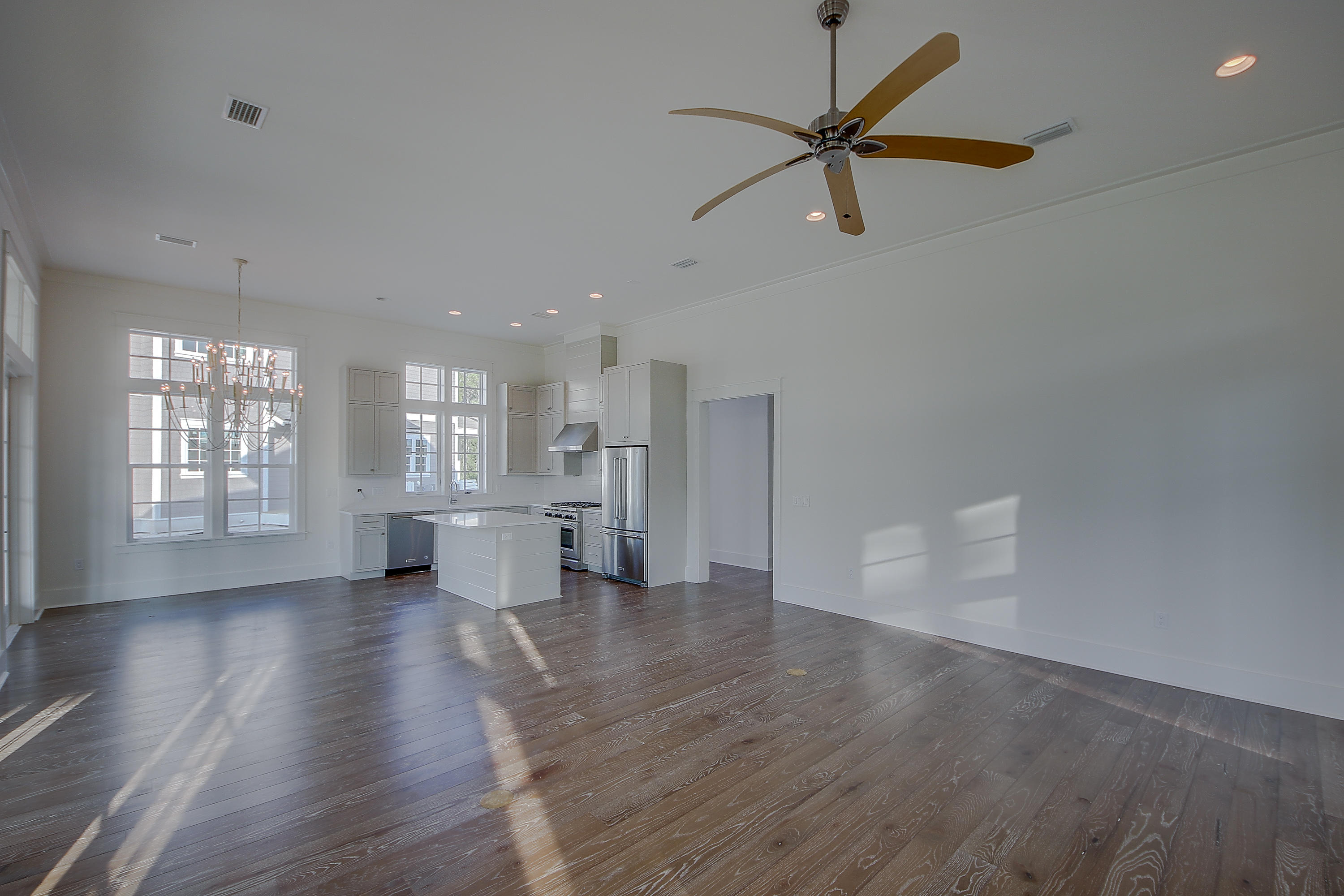355 Pathways Drive, Unit LOT 90 Watersound, FL 32461 - Photo 6 of 24 a view of an empty room with a window and wooden floor