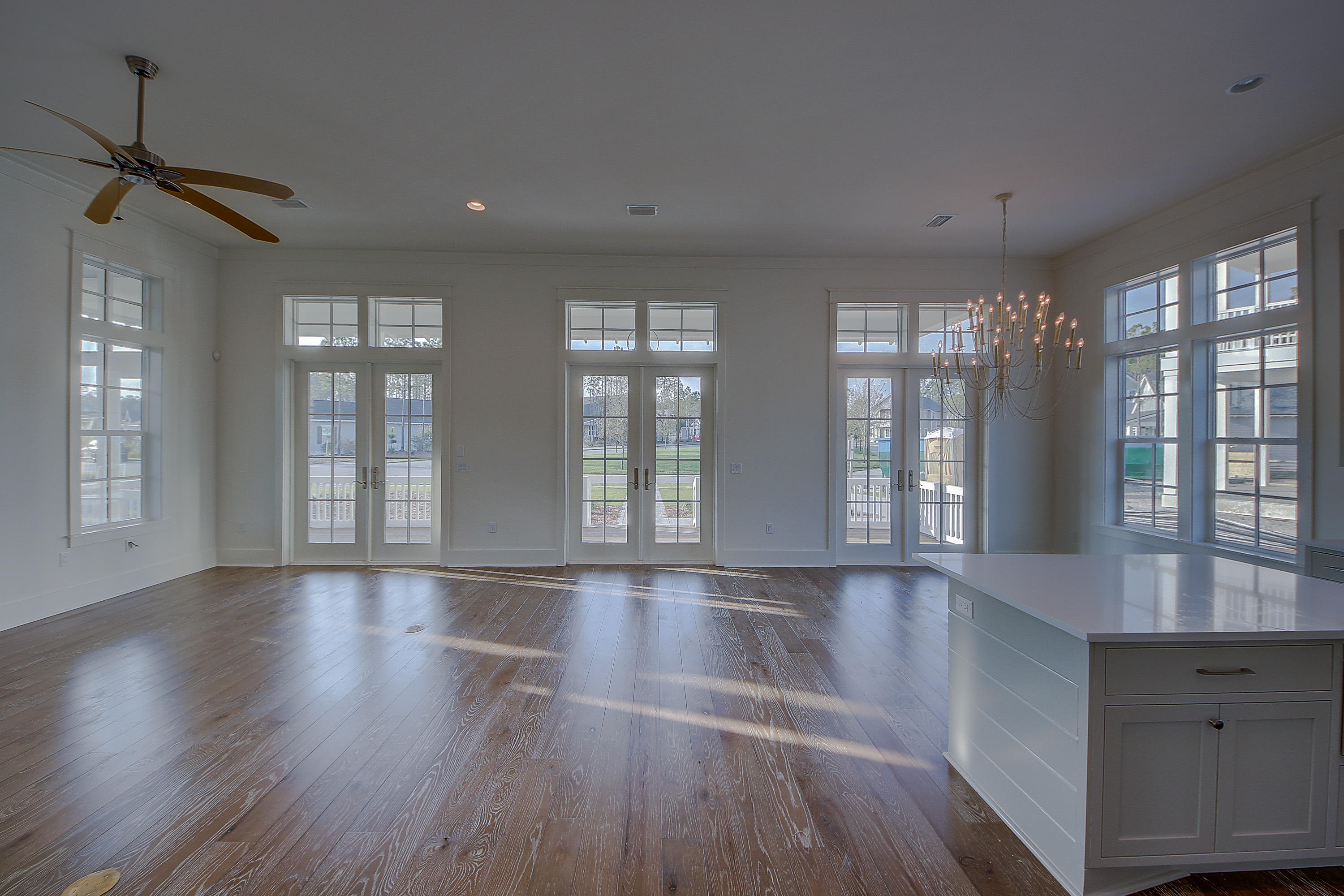 355 Pathways Drive, Unit LOT 90 Watersound, FL 32461 - Photo 7 of 24 a view of an empty room with wooden floor and a window