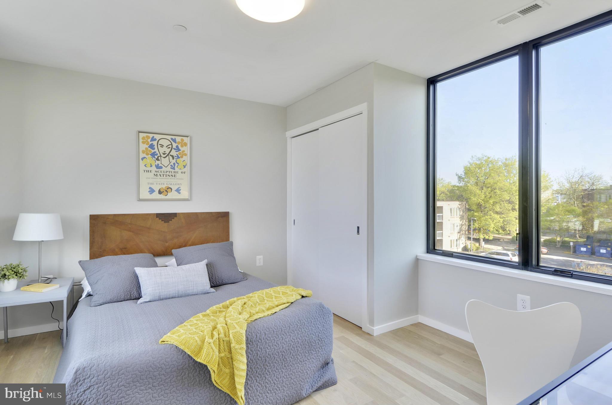 706 16th Street Northeast, Unit 2 Washington, DC 20002 - Photo 12 of 26 a bedroom with a bed and a couch