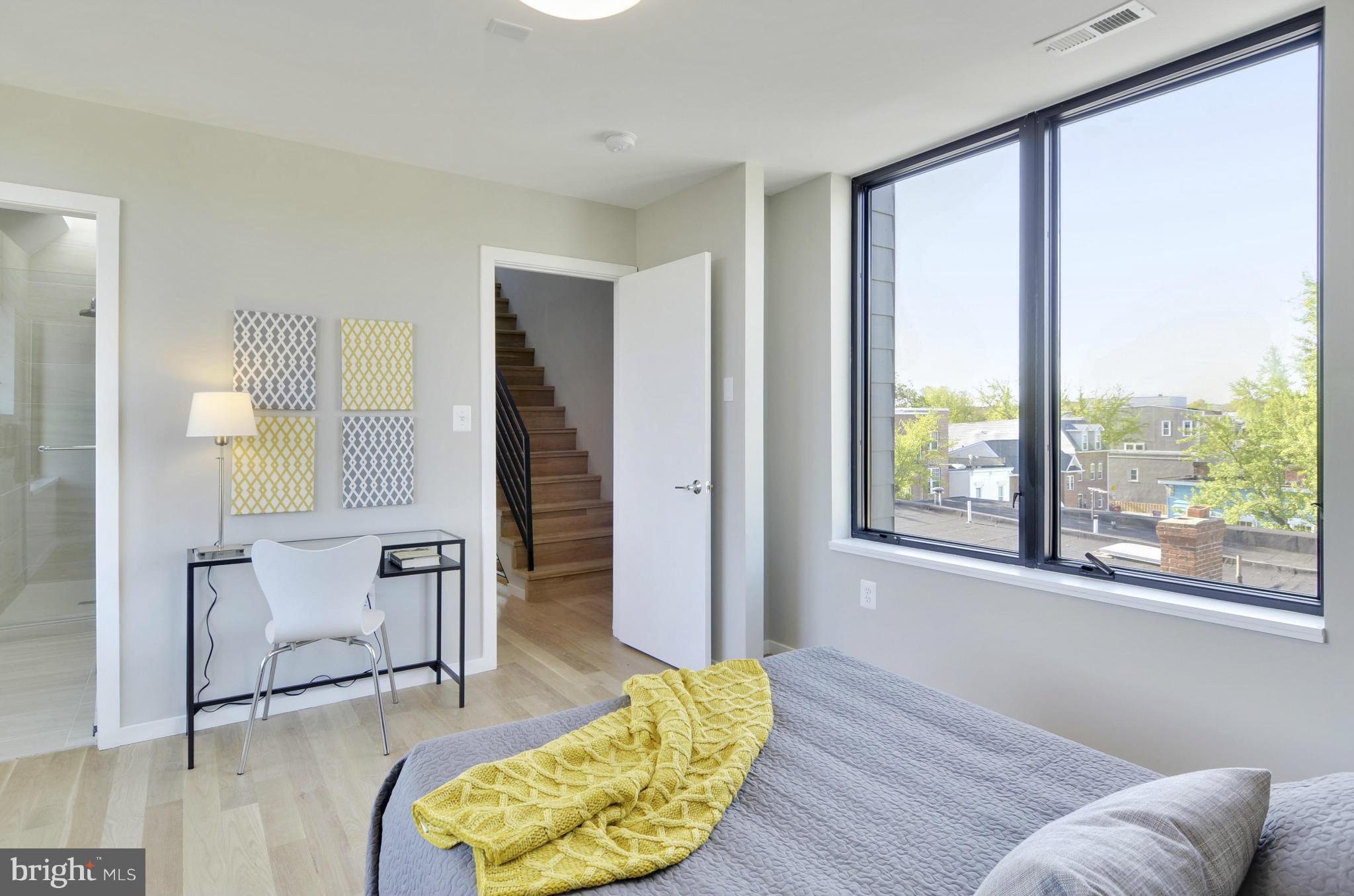 706 16th Street Northeast, Unit 2 Washington, DC 20002 - Photo 13 of 26 a living room with furniture and a large window