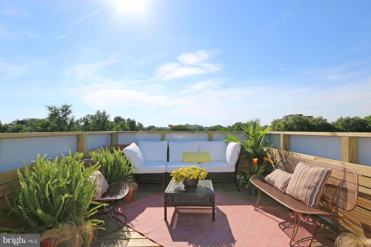 706 16th Street Northeast, Unit 2 Washington, DC 20002 - Photo 18 of 26 a view of a patio with couches chairs and a potted plant
