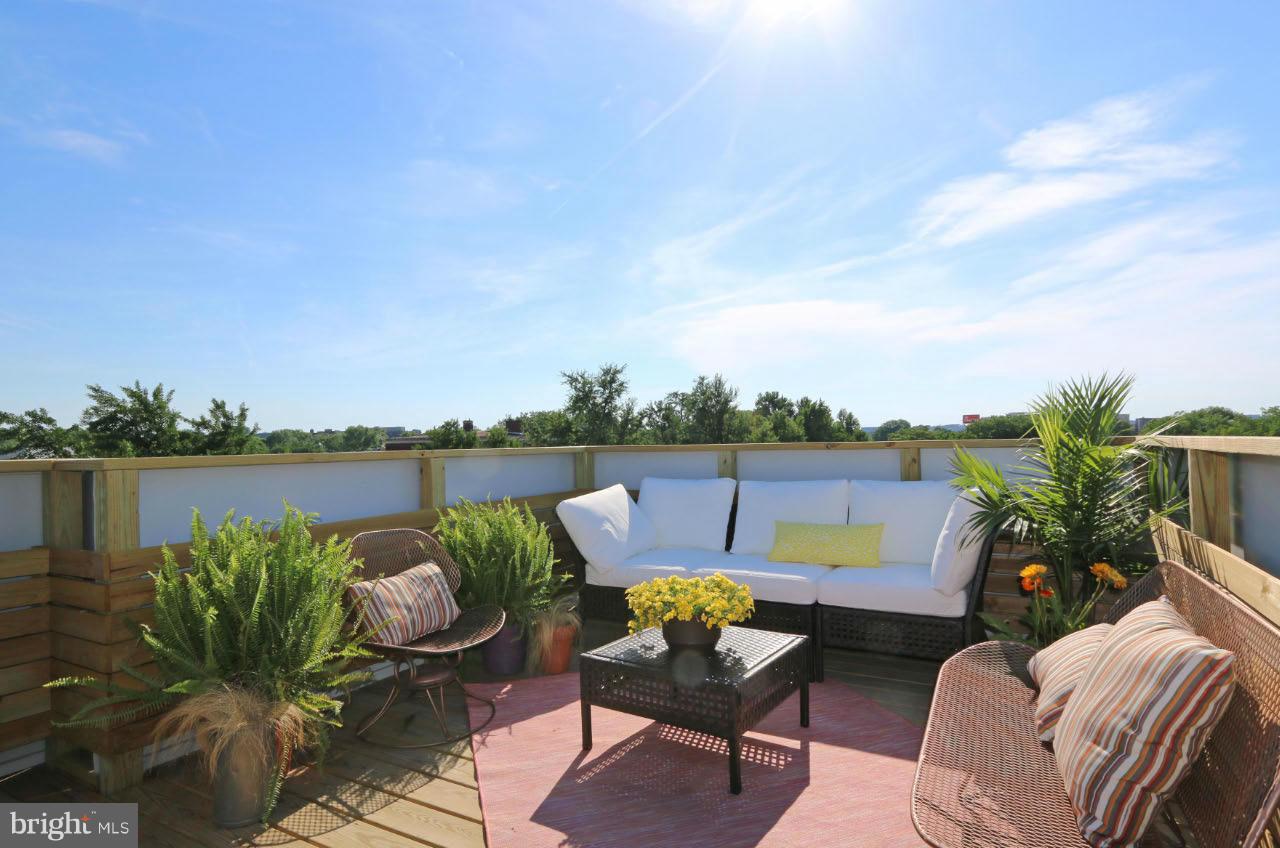706 16th Street Northeast, Unit 2 Washington, DC 20002 - Photo 19 of 26 a backyard with furniture and lake view