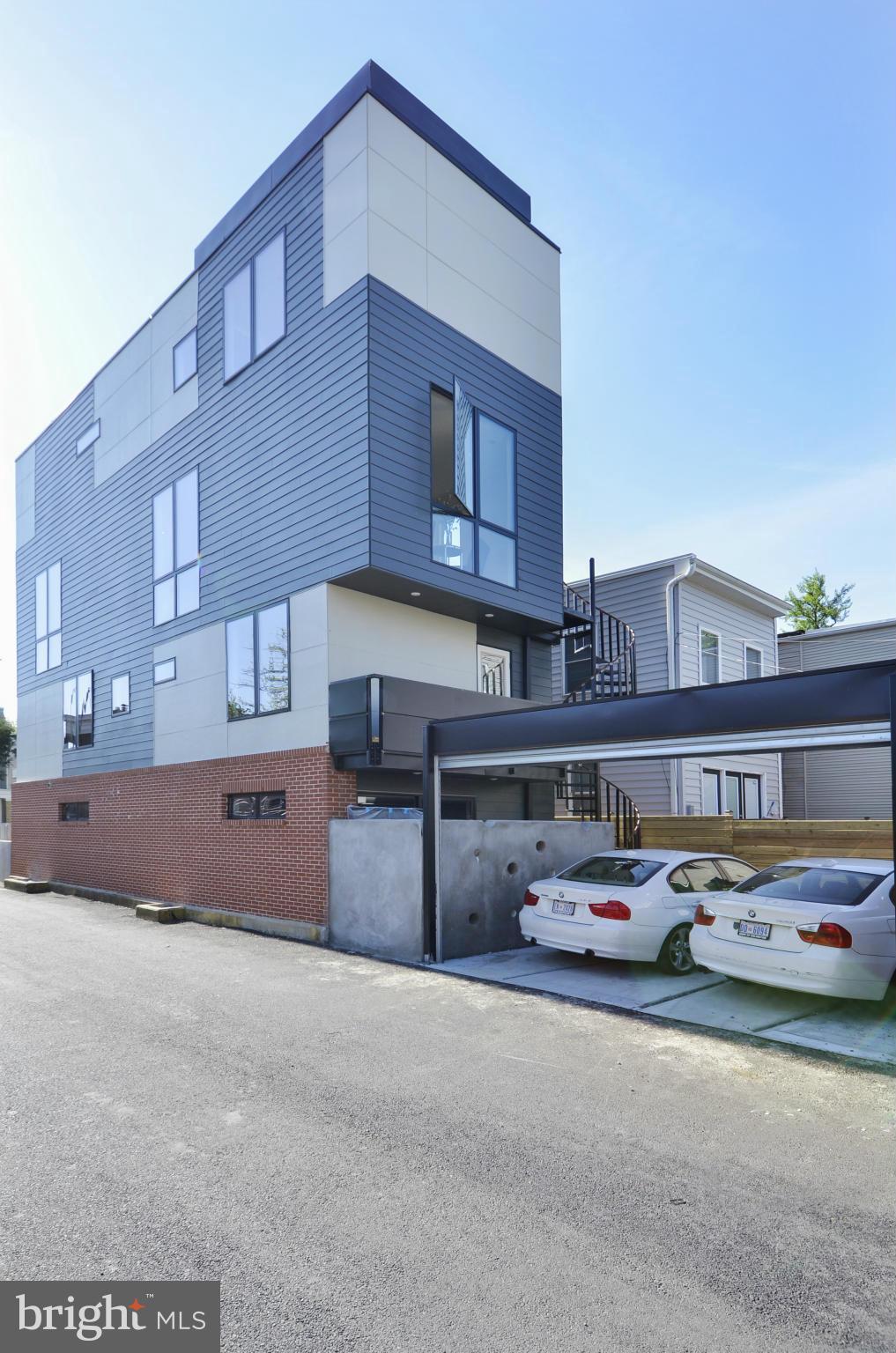 706 16th Street Northeast, Unit 2 Washington, DC 20002 - Photo 25 of 26 a front view of a building with parking