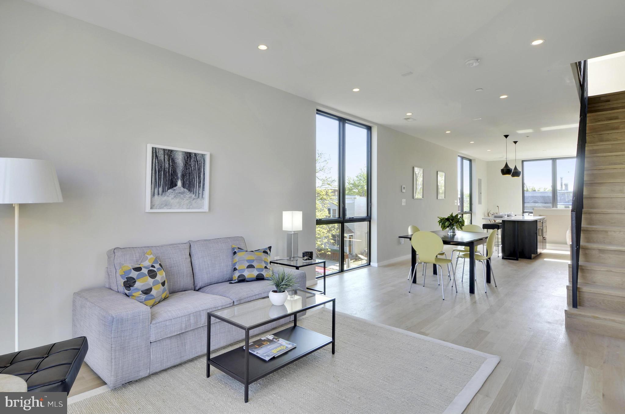 706 16th Street Northeast, Unit 2 Washington, DC 20002 - Photo 5 of 26 a living room with furniture and a table