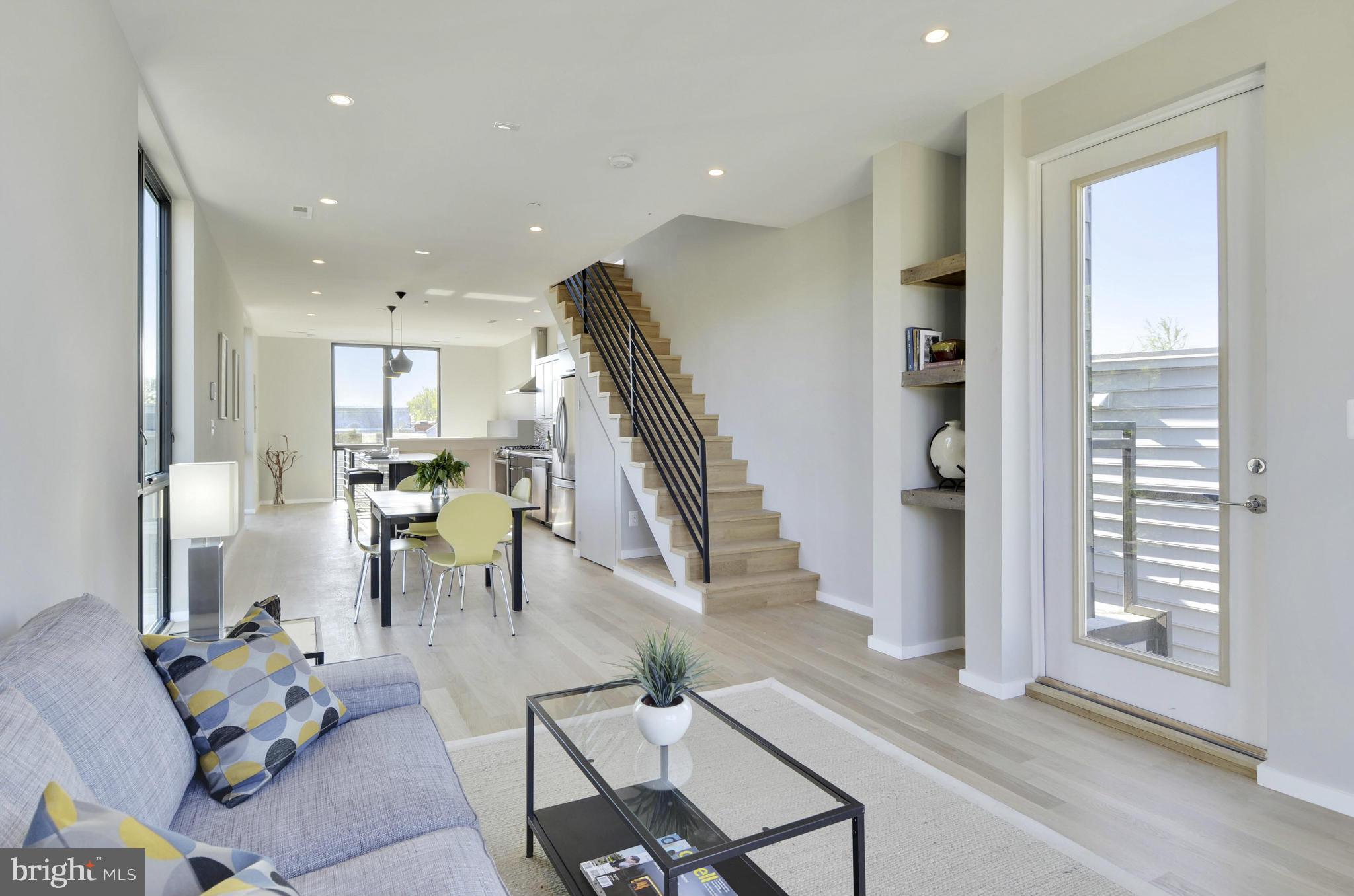706 16th Street Northeast, Unit 2 Washington, DC 20002 - Photo 6 of 26 a living room with furniture and wooden floor