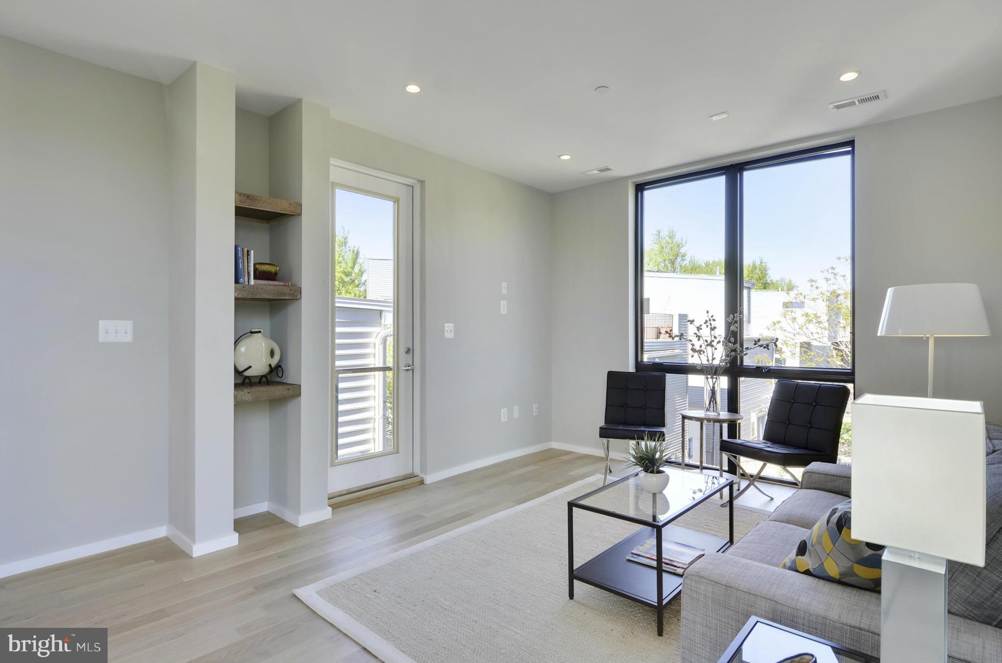 706 16th Street Northeast, Unit 2 Washington, DC 20002 - Photo 7 of 26 a living room with furniture and a window
