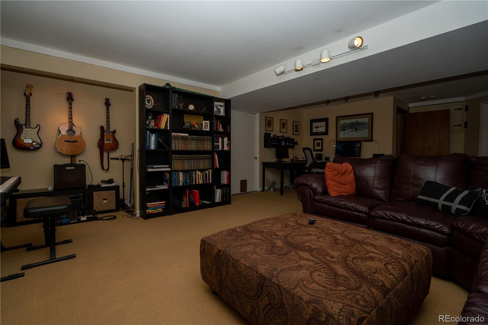 8583 Redstone Street Highlands Ranch, CO 80126 - Photo 13 of 17 a bed room with a bed and furniture