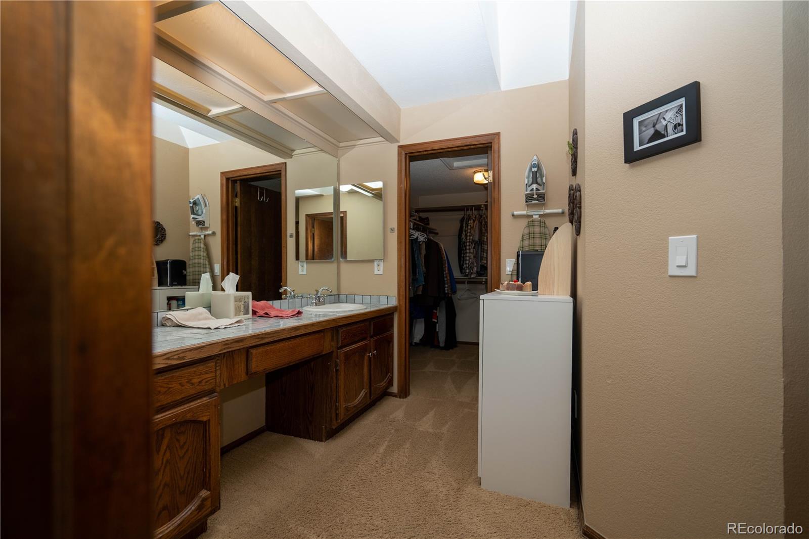 8583 Redstone Street Highlands Ranch, CO 80126 - Photo 7 of 17 a room with a sink and a mirror