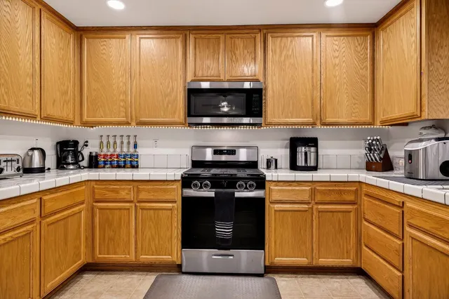 a kitchen with granite countertop sink cabinets and window