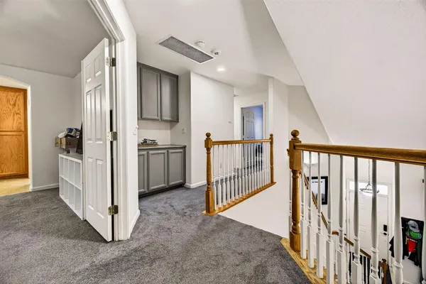 a bedroom with bed and a window