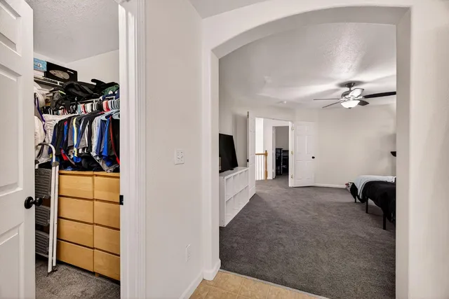 a spacious bathroom with a double vanity sink a mirror and a shower