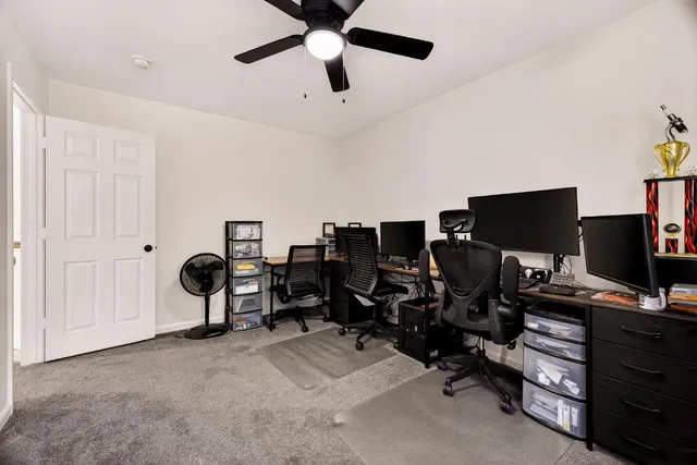a kitchen with white cabinets and sink