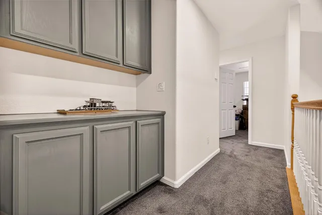 a kitchen with a refrigerator and a stove