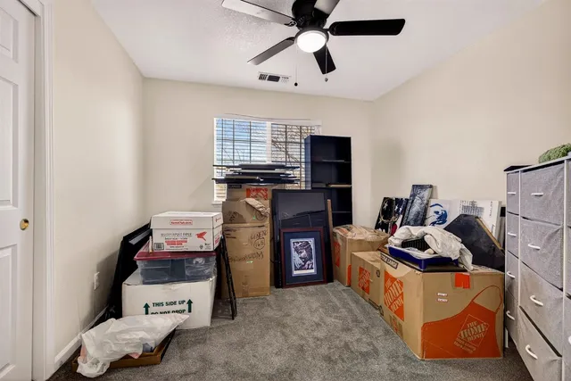 a view of a room with a baby crib and a dresser