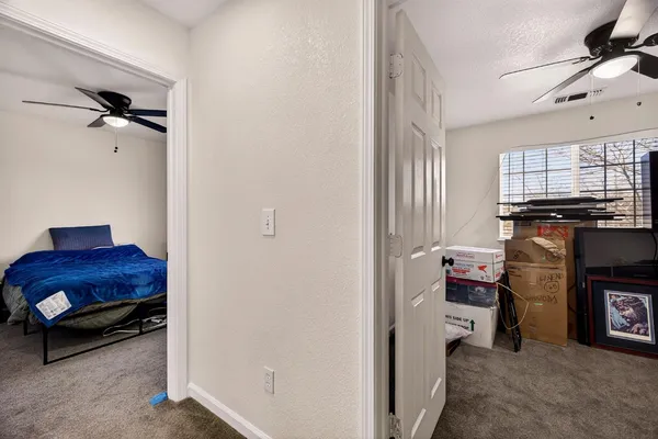 a bedroom with a bed and window