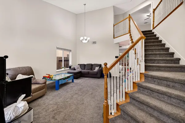 a living room with furniture or stairs and a couch