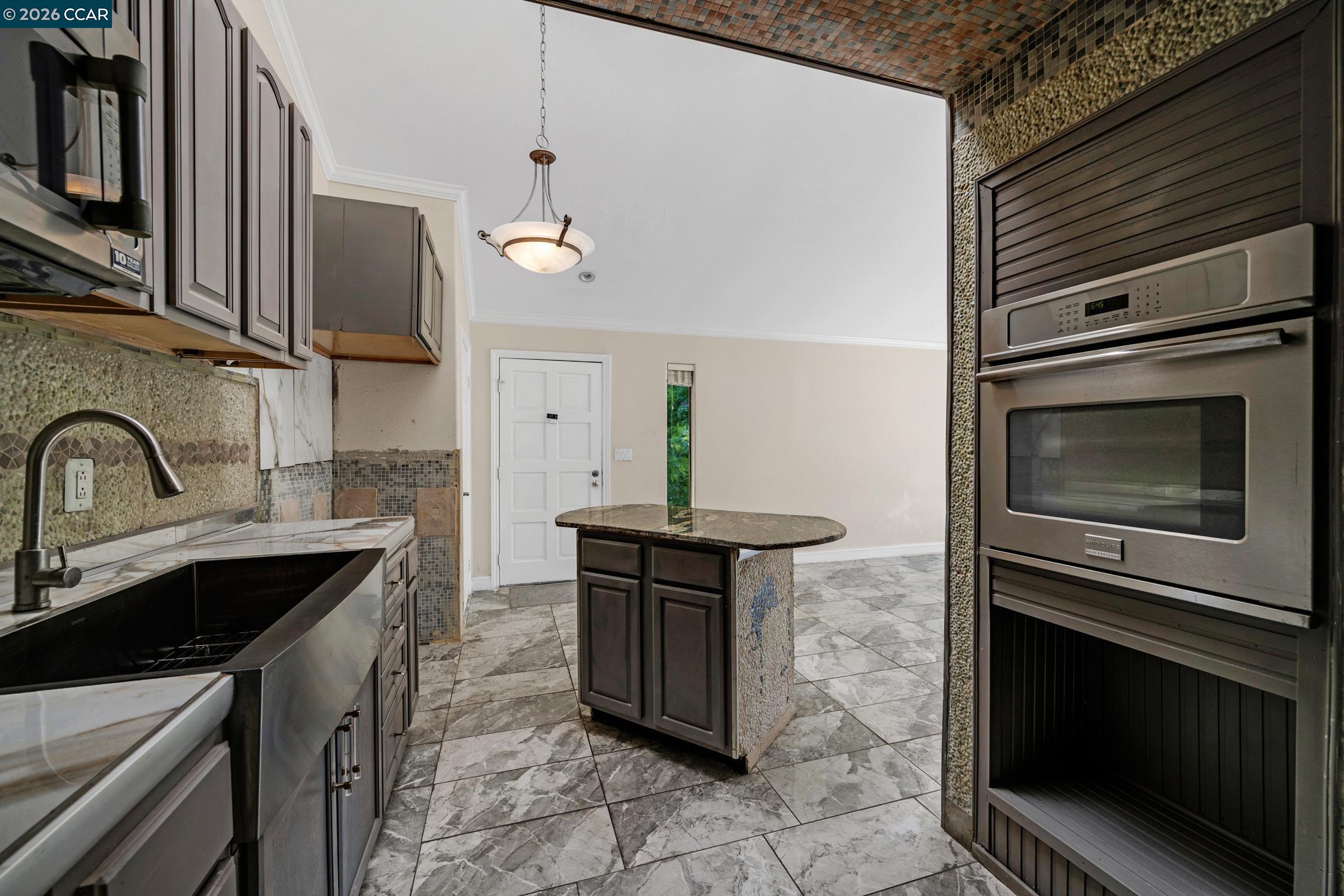 1544 Bailey Road, Unit 30 Concord, CA 94521 - Photo 14 of 33 a kitchen with stainless steel appliances a stove sink and cabinets