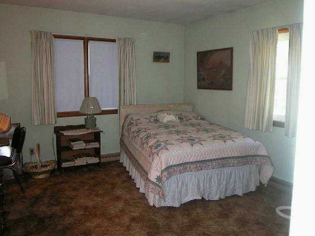 10137 Benson Road Lanark, IL 61046 - Photo 8 of 8 a bedroom with a bed and a window