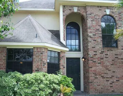 a front view of a house with glass windows