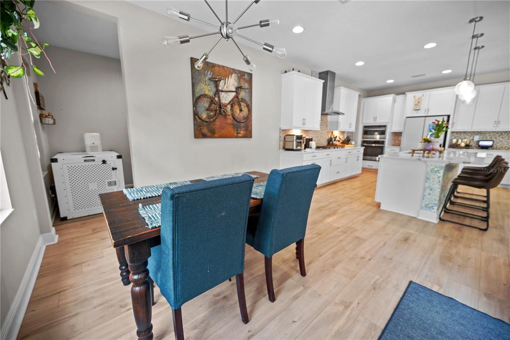 14734 Horse Trot Road Lithia, FL 33547 - Photo 14 of 66 a view of a dining room with furniture window and wooden floor