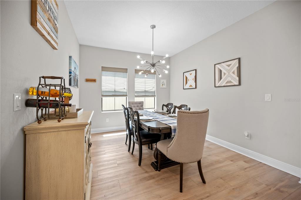 14734 Horse Trot Road Lithia, FL 33547 - Photo 15 of 66 a view of a dining room with furniture window and wooden floor