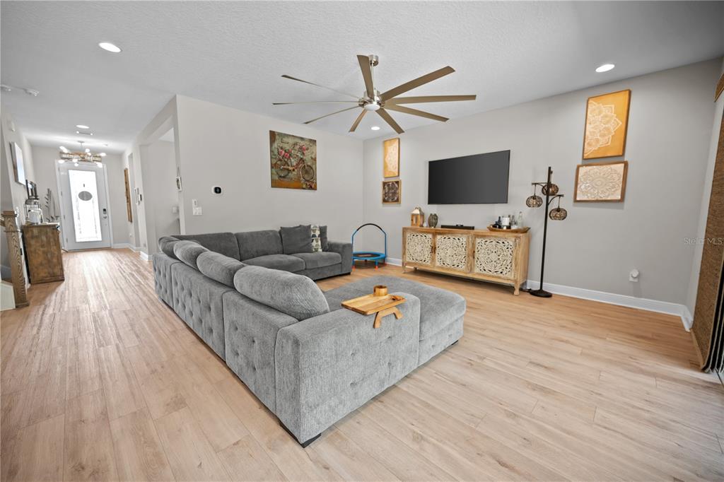 14734 Horse Trot Road Lithia, FL 33547 - Photo 17 of 66 a living room with furniture and a flat screen tv