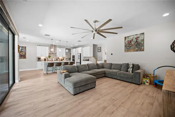 a view of a dining room with furniture and chandelier