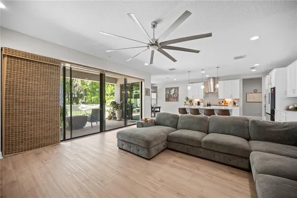 a spacious bedroom with a bed and a window