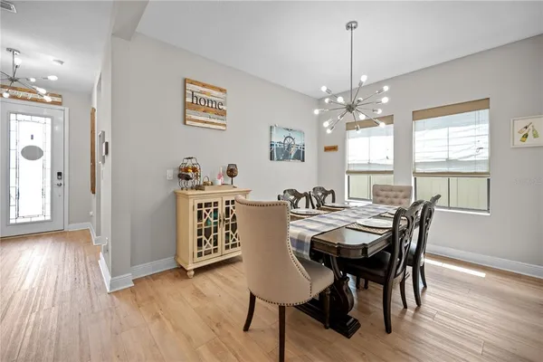 a view of a livingroom with wooden floor and staircase
