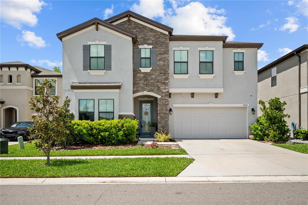 14734 Horse Trot Road Lithia, FL 33547 - Photo 2 of 66 a front view of a house with a yard