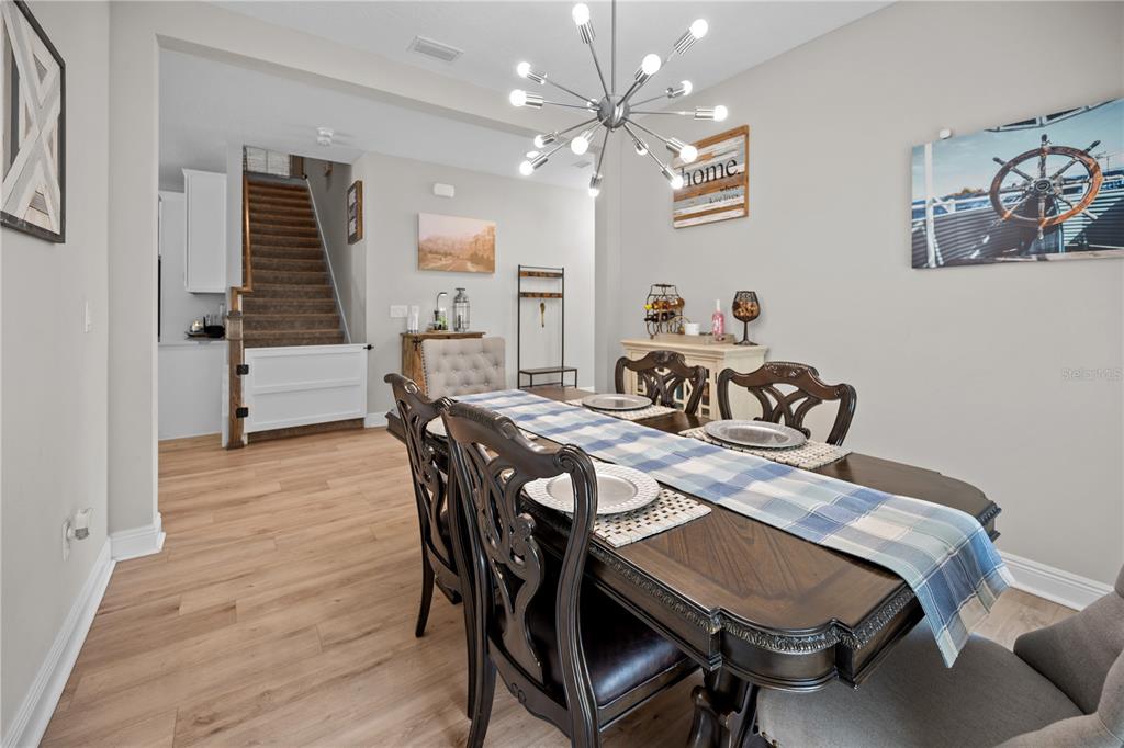 14734 Horse Trot Road Lithia, FL 33547 - Photo 21 of 66 a view of a dining room with furniture and chandelier