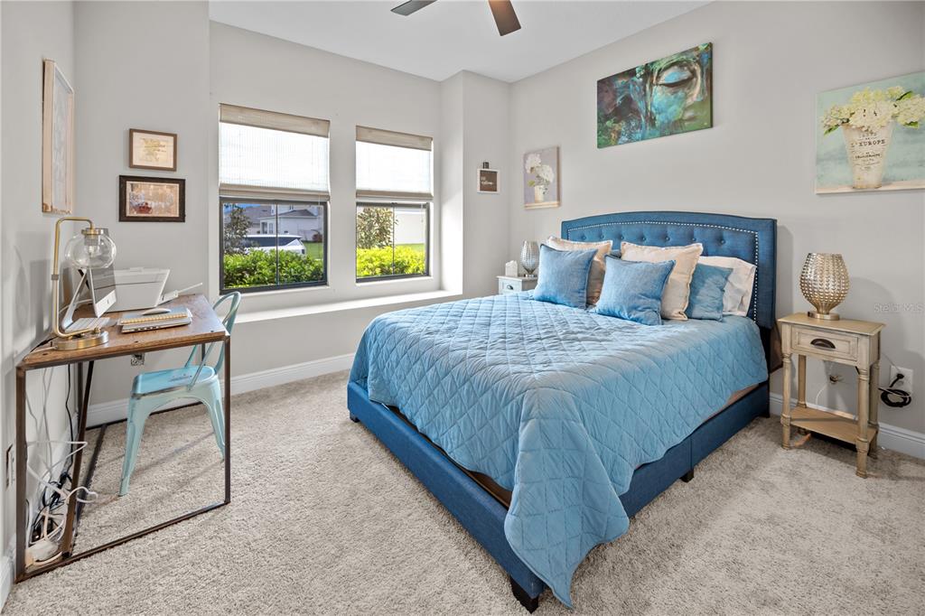 14734 Horse Trot Road Lithia, FL 33547 - Photo 22 of 66 a spacious bedroom with a bed and a window