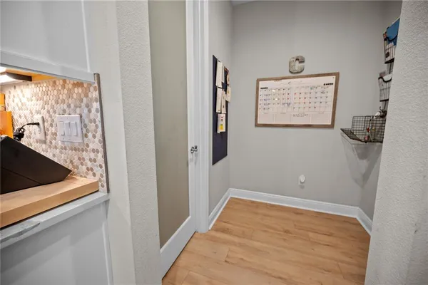 a view of backyard with a patio and a garden