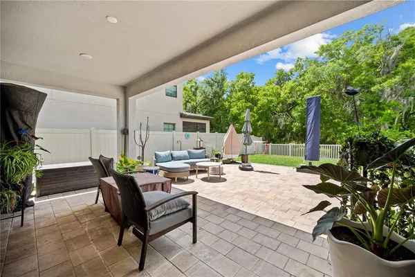 a view of a patio with a table and chairs