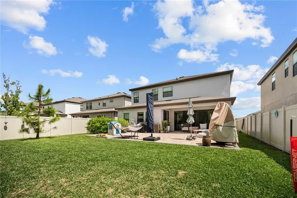 a bedroom with a bed furniture and a flat tv screen