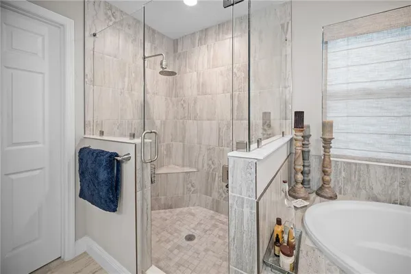 a bedroom with bed and a window